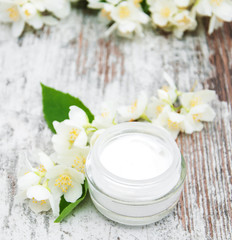 Fototapeta na wymiar Moisturizing cream with jasmine flowers