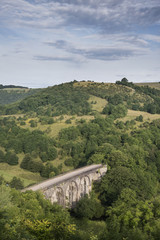 Fototapeta na wymiar Colorful landscape image of Headstone Viaduct and Monsal Head in Peak District in Summer