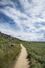 Fototapeta na wymiar Beautiful vibrant landscape image of Burbage Edge and Rocks in Summer in Peak District England