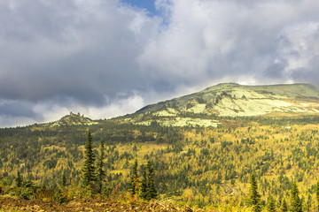 Scenic mountain landscape in a cloud summer day. Sheregesh, Russia.