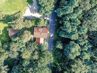 Old building settlement with houses and properties with gardens, aerial photo .