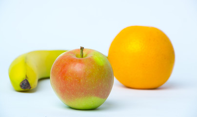 Apple and banana on a white background
