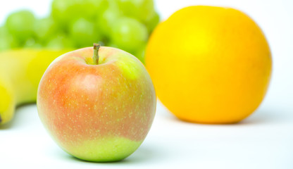 Apple and banana on a white background