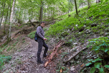 Naklejka na ściany i meble Teenager hiker on a trail