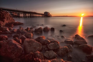 A calm morning at Mumbles Pier, showing the new lifeboat station, Swansea, South Wales, UK