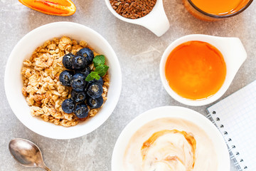 Healthy breakfast - muesli with blueberry and honey