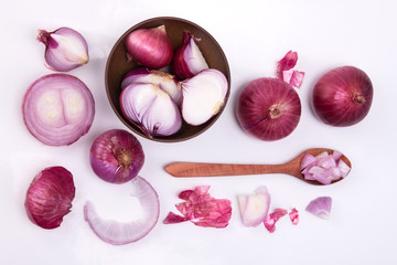  Fresh red onion sliced bulb and onion peel isolated on white background  , overhead shot and top view