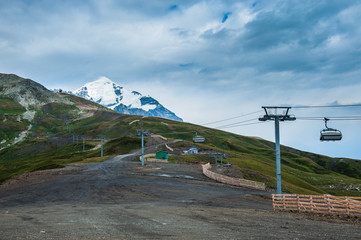 Mountain valley with snow peaks and clouds in Tetnuldi, Mestia, Georgia