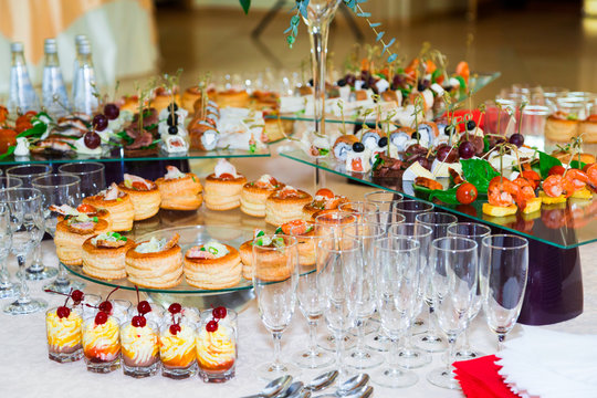 Snacks, fish and meat specialities on the buffet. Desserts. A gala reception. Served tables. Catering.