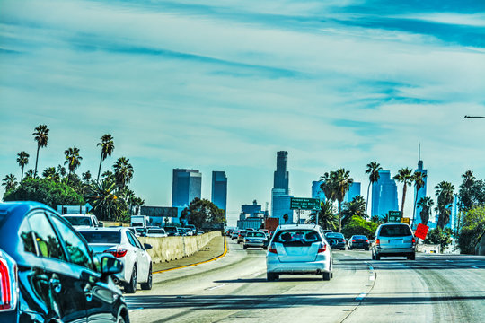 Traffic in Hollywood freeway with downtown L.A. in the background