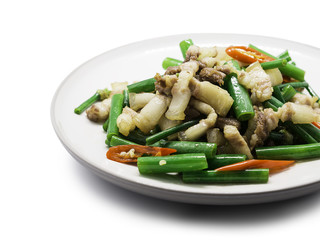 Streaky pork fried with spring onion flower and chili on white disk isolated on white background.clipping path included.