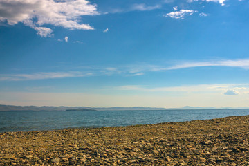 Uninhabited pebble beach, the sea