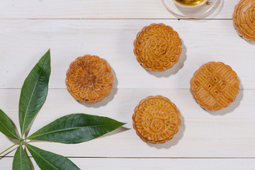 Mooncake and tea, Chinese mid autumn festival food. Angle view from above