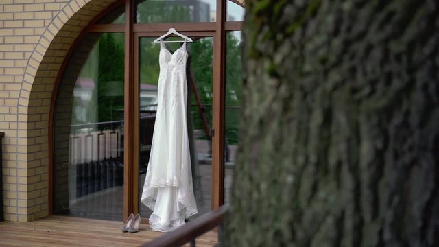 White wedding dress on terrace
