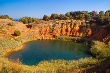 Fototapeta na wymiar Lake near a quarry of bauxite, Italy