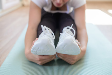 Closeup with hands around feet while playing sports