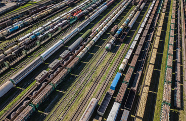 Aerial view of colorful freight wagons on the railway station