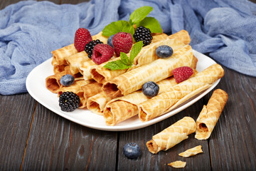 Delicious waffle rolls with berries