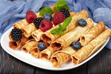 Delicious waffle rolls with berries