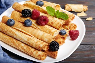 Delicious waffle rolls with berries