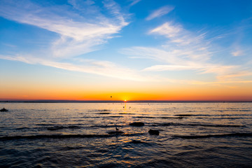 Bright sky and water at sunset