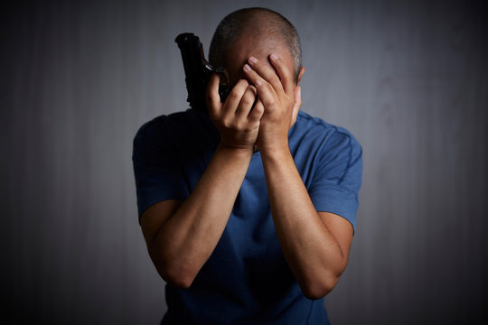 suicide simulation - A man with the gun at his head 