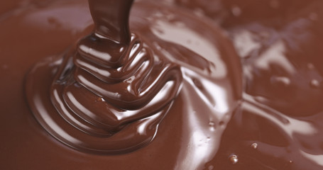 pouring melted premium dark chocolate