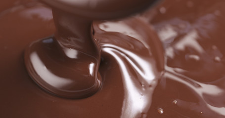 pouring melted premium dark chocolate