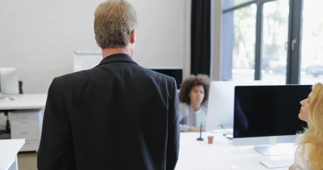 Boss Businessman Walk Through Modern Office With Working Colleagues While African American Worker Ask Question Raising Hand Up Slow Motion 60 - Powered by Adobe