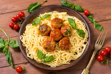 Spaghetti in pan with meatballs