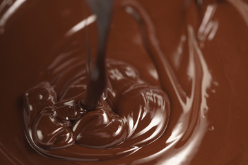 pouring melted premium dark chocolate from above
