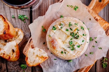 Baked camembert with toasts and thyme
