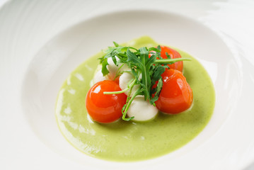 cream soup with tomato and mozzarella