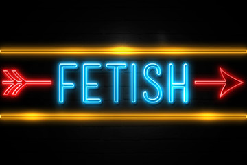 Fetish  - fluorescent Neon Sign on brickwall Front view