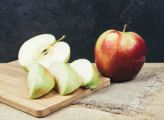 Fresh apple on a wooden background.