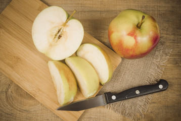 Fresh apple on a wooden background.