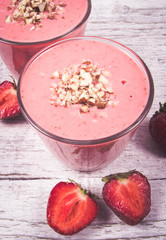 Strawberry smoothie with fresh fruit .