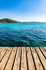 Beautiful ocean view from the wooden pier to the mediterranean coast