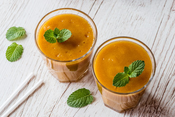 Healthy beverage - fresh blended peach smoothie with mint