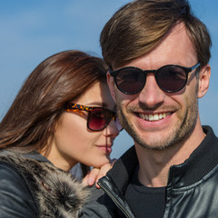 Obraz premium pair of lovers in sunglasses are laughing.