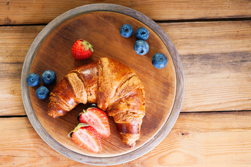 Fresh croissant and berries 