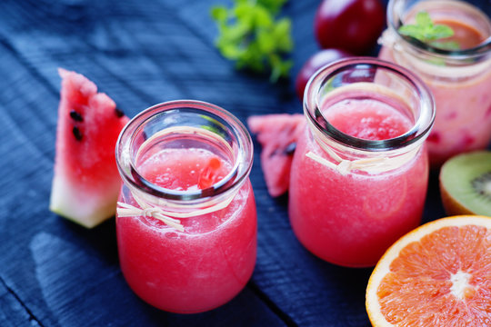 Jars with smoothies and fruits 