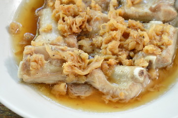 steamed pork rib with dry salt preserved vegetable on plate