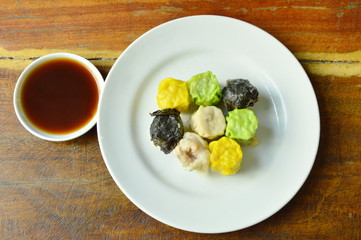 assorted steamed Chinese dim sum eat couple with soy sauce