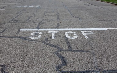 The word stop painted white on the road.
