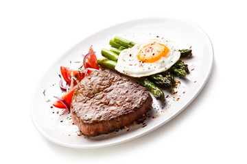 Grilled steak with asparagus and fried egg 