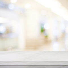 Empty white marble over blur store background, product and food display montage