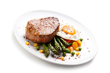 Grilled steak with asparagus and fried egg 