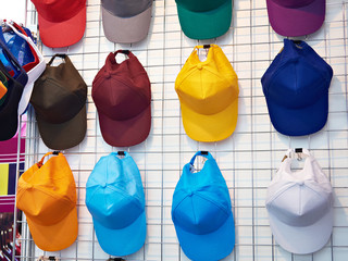 Baseball caps on wall in shop window