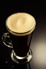 coffee in glass cup on black background